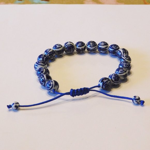 Asian Themed Adjustable String Bracelet - Like new - Picture 2 of 3